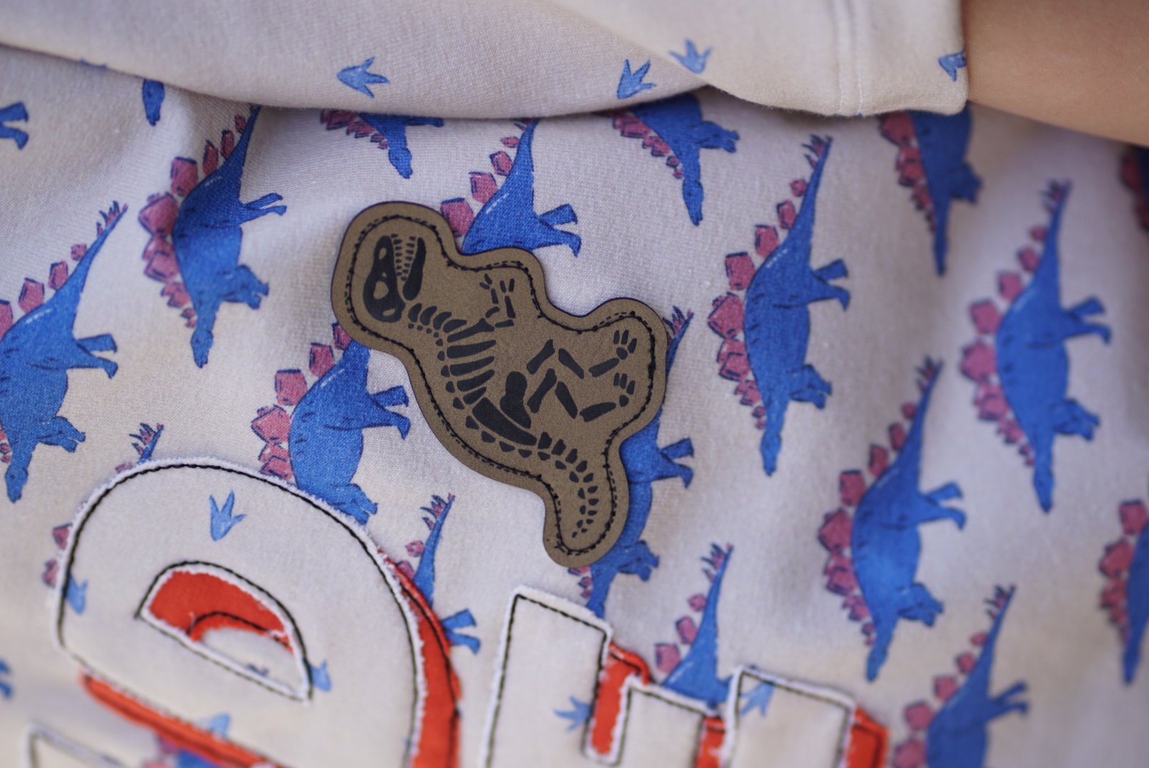Organic fabric - Stone Age Stegosaurus Squad blue