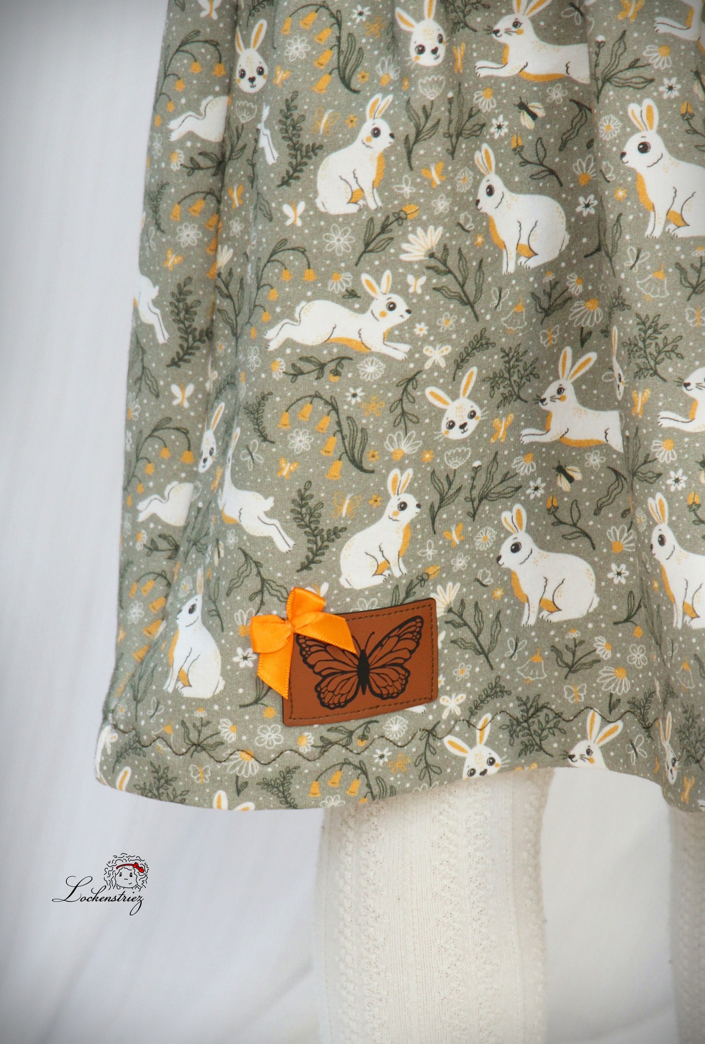 Bio Webware Stoff  -  Happy Bunnies  - PrettyLittlePigs, Tiere, Ostern, gelb, schwarz, 100% Bio-Baumwolle