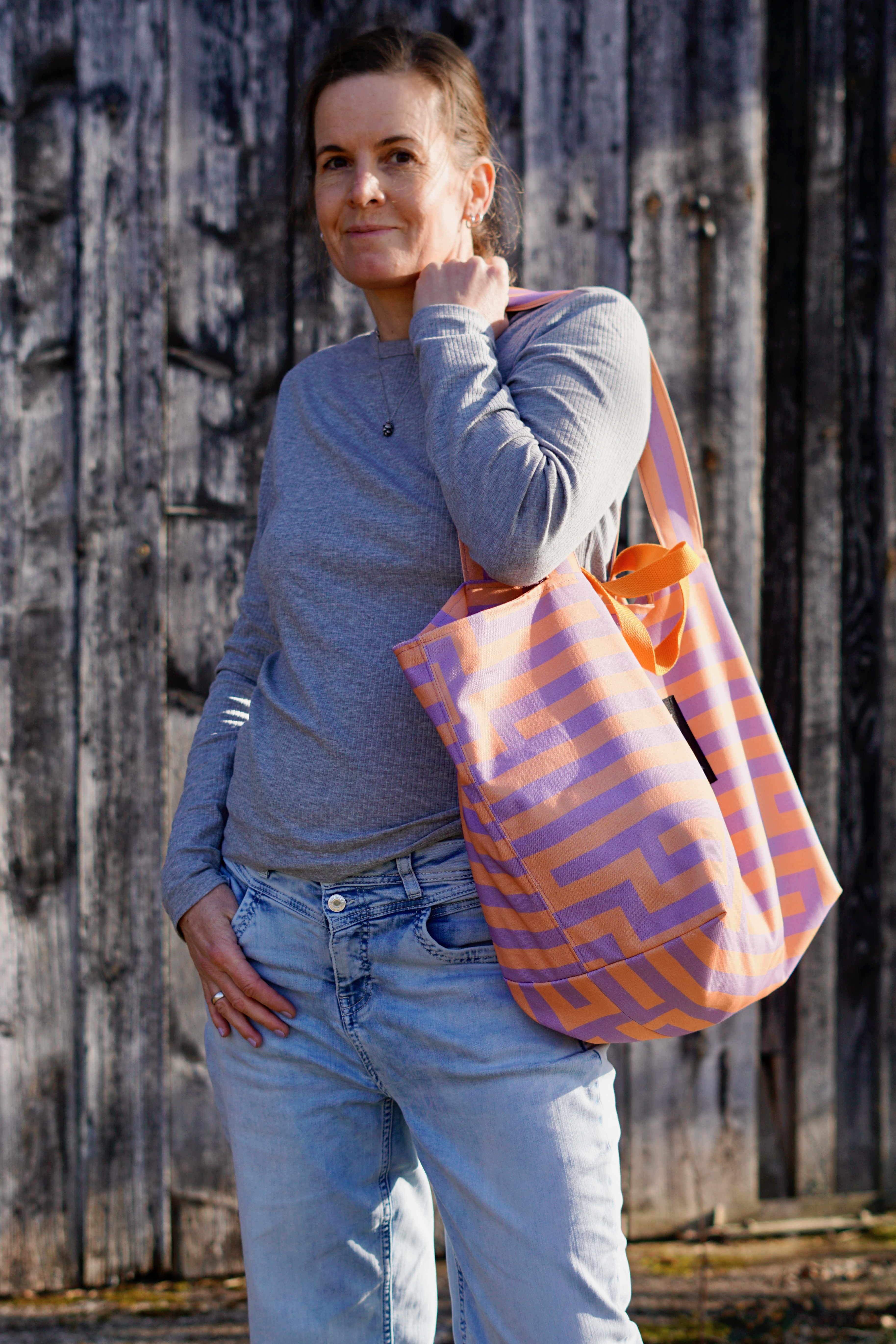 Bio Stoff - Gleichklang Vertikalstreifen flieder, koralle